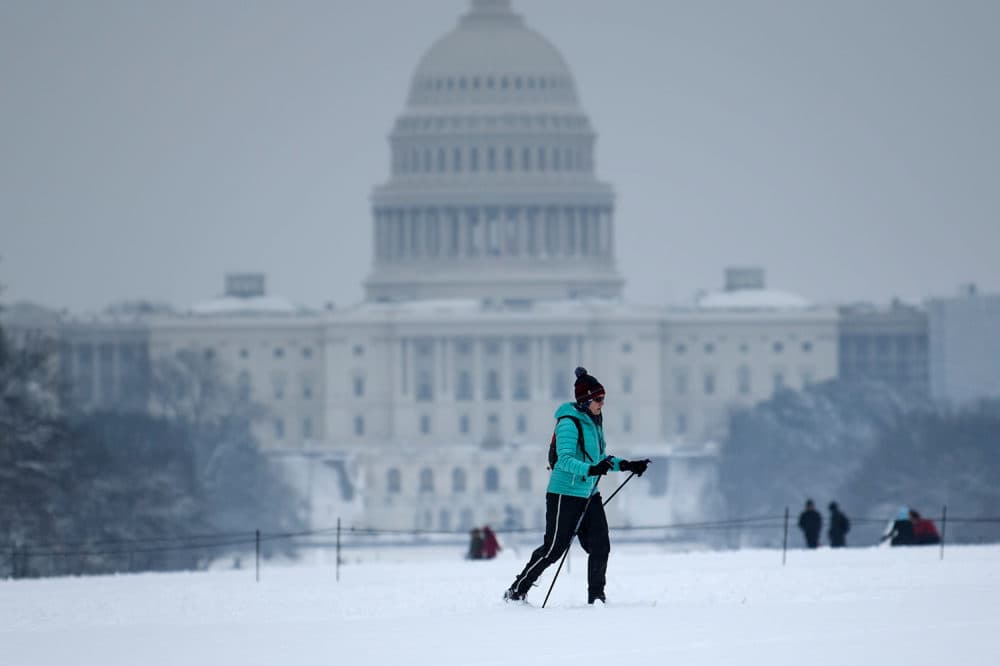 A cross-country skier passes the U.S. Capitol on the National Mall on the 23rd day of a government shutdown during a winter storm on Jan. 13, 2019 in Washington, D.C. (Brendan Smialowski/AFP/Getty Images)