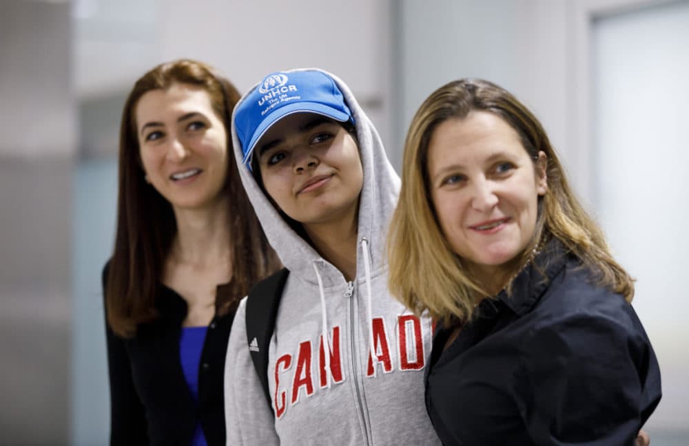 Asylum-seeker Rahaf Mohammed al-Qunun, 18, smiles as she is introduced to the media at Toronto Pearson International Airport, alongside Canadian Minister of Foreign Affairs Chrystia Freeland, right, on Jan. 12, 2019 in Toronto, Canada. Al-Qunun, a Saudi Arabian woman who fled her family saying she feared for her life, landed in Canada. (Cole Burston/Getty Images)