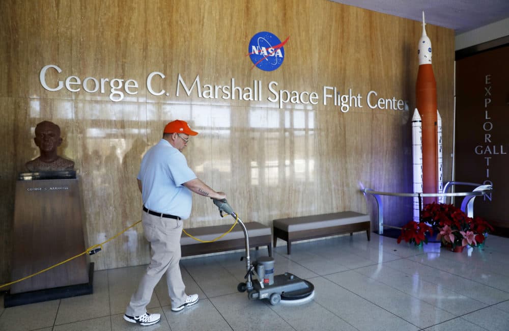 A worker cleans the floors at NASA's Marshall Space Flight Center, which has been impacted by the partial federal government shutdown, at the Army's Redstone Arsenal in Huntsville, Ala., Wednesday, Jan. 9, 2019. (David Goldman/AP)