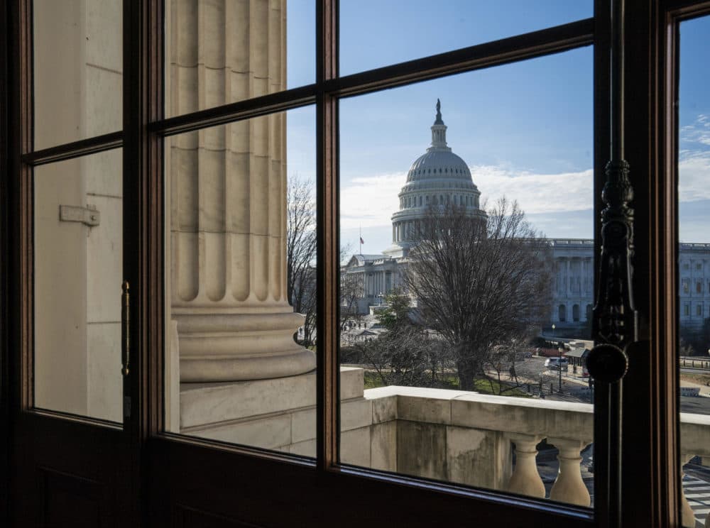 A view of the U.S. Capitol dome as seen through a window from the Russell Senate building on Dec. 27. (J. Scott Applewhite/AP)