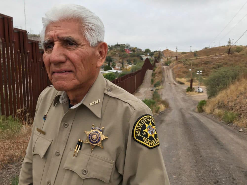 In this Dec. 5, 2017, photo, Santa Cruz County Sheriff Tony Estrada poses for a photo in Nogales, Ariz., on the U.S. side of the international boundary with Nogales, Mexico, where he was born. Estrada is a critic of President Trump's immigration policies and plans for a &quot;big, beautiful&quot; border wall. (Anita Snow/AP)
