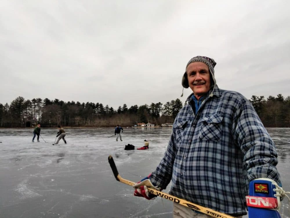 Massachusetts state geologist Steve Mabee, and UMass colleagues, marvel at the ice on Metacomet Lake in Belchertown, Mass., on Jan. 18. (Jill Kaufman/NEPR)