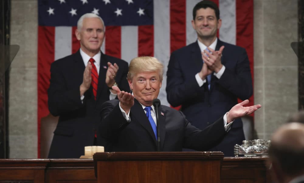 President Donald Trump gestures as delivers his first State of the Union address in the House chamber of the U.S. Capitol to a joint session of Congress Tuesday, Jan. 30, 2018 in Washington, as Vice President Mike Pence and House Speaker Paul Ryan applaud. (Win McNamee/AP)