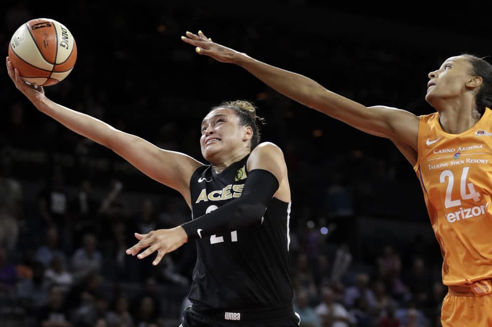 Las Vegas Aces guard Kayla McBride shoots around Phoenix Mercury forward DeWanna Bonner during the second half of a WNBA basketball game Wednesday, Aug. 1, 2018, in Las Vegas. The Aces refused to play a game in August 2018 citing injury risks, something no women's team had ever done. (John Locher/AP)