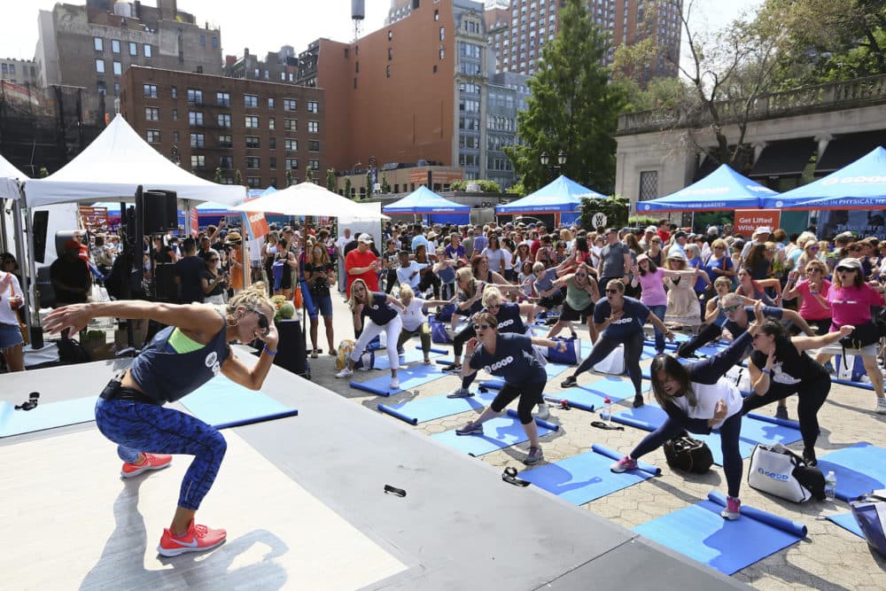 At a WW GOOD wellness festival powered by Weight Watchers “WW” in Union Square, New York City residents engage in a movement and meditation series (“LIFTED”) led by Celebrity Fitness Instructor Holly Rilinger, Sunday, August 26, 2018. (Stuart Ramson/Weight Watchers via AP Images)