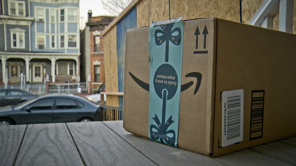 An Amazon package sits on the porch of a Jersey City, N.J. residence after its delivery Tuesday, Dec. 11, 2018. (Robert Bumsted/AP)