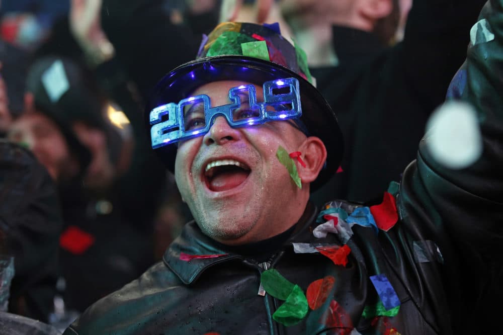 A reveler celebrates as confetti falls during a celebration of the new year in New York's Times Square in New York on Tuesday, Jan. 1, 2019, as they take part in a New Year's Eve celebration. (Adam Hunger/AP)