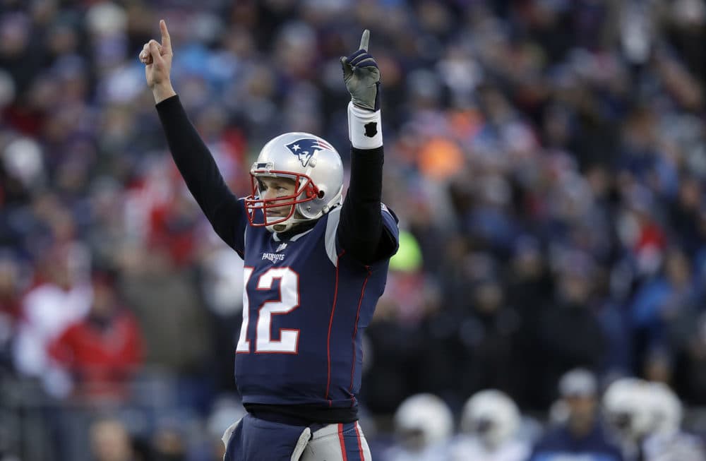 Patriots quarterback Tom Brady celebrates a touchdown run by running back Sony Michel during the first half against the Los Angeles Chargers Sunday. (Charles Krupa/AP)