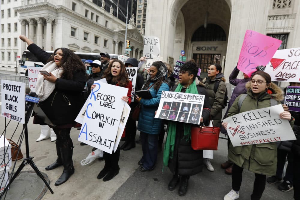 Sonja Spoo, left, associate campaign director of Ultra Violet, leads chants during an R. Kelly protest outside Sony headquarters, in New York, Wednesday, Jan. 16, 2019. Kelly has been under fire since the recent airing of a Lifetime documentary &quot;Surviving R. Kelly .&quot; He has denied all allegations of sexual misconduct involving women and underage girls. (Richard Drew/AP)