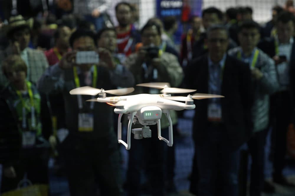 A drone hovers at the DJI booth during CES International in Las Vegas. (John Locher, File/AP)