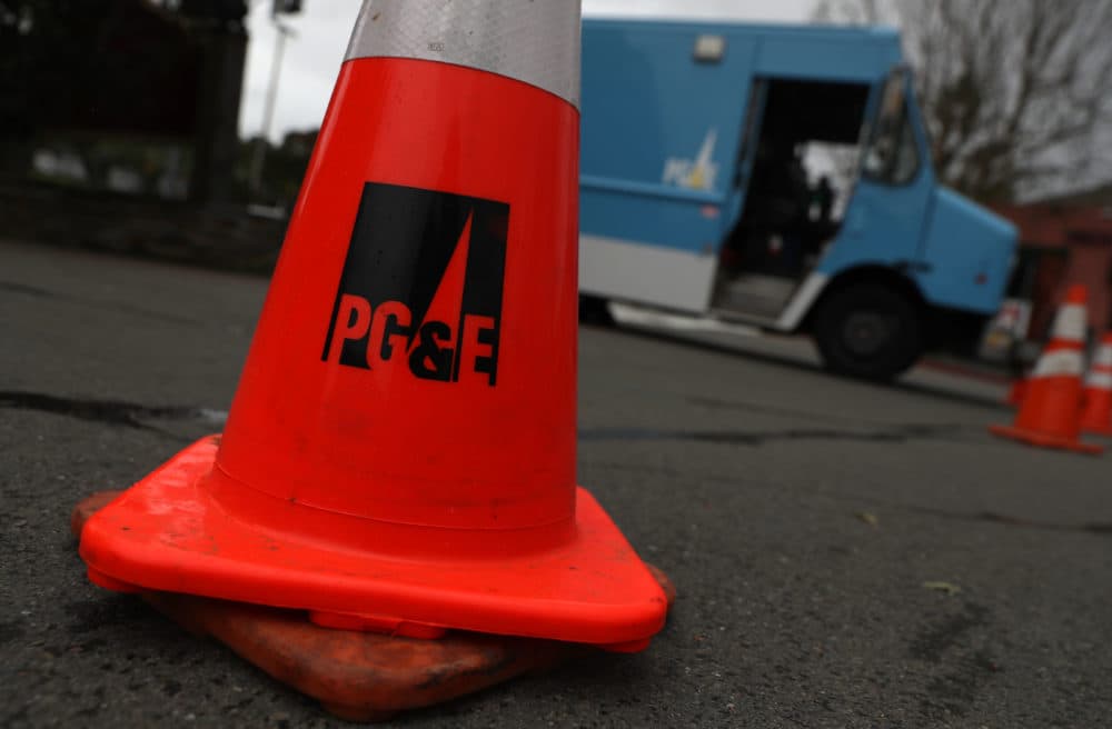 A traffic cone sits next to a Pacific Gas and Electric Company truck on Jan. 17, 2019 in Fairfax, Calif. PG&E announced that they are preparing to file for bankruptcy at the end of January as they face an estimated $30 billion in legal claims for electrical equipment that might have been responsible for igniting destructive wildfires in California. (Justin Sullivan/Getty Images)