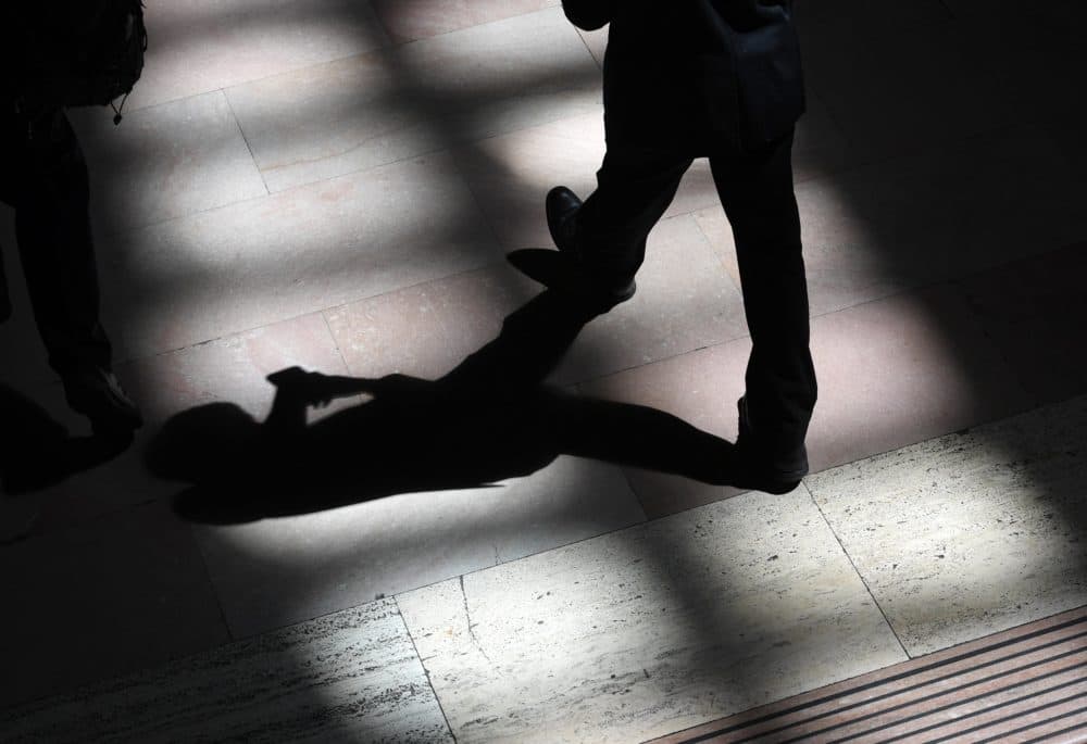 A man walks through the afternoon shadows on the tile floor at Grand Central Terminal in New York on Aug. 23, 2017. (Timothy A. Clary/Getty Images)