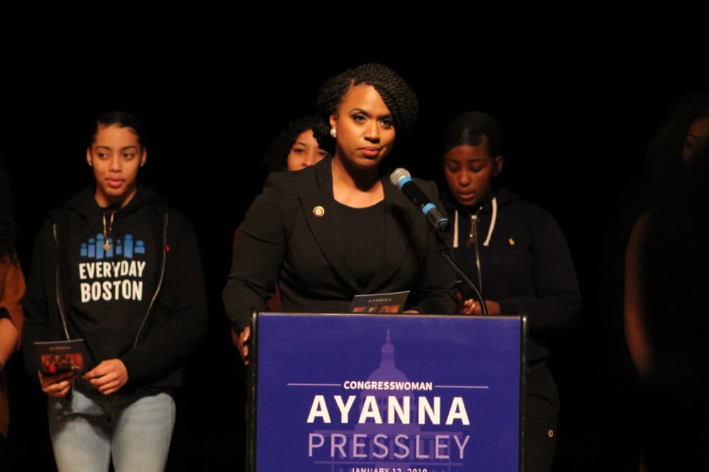 Ayanna Pressley addresses a crowd during her informal community swearing-in at Roxbury Community College. (Quincy Walters/WBUR)