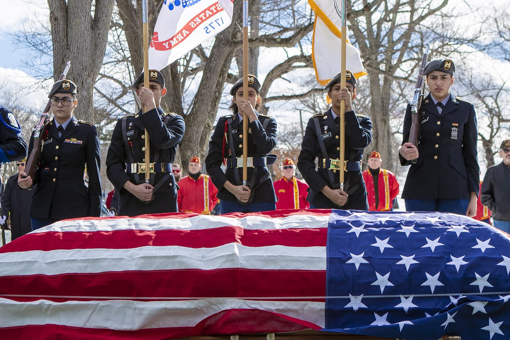 The body of veteran James McCue was buried with full military honors at Bellevue Cemetery in Lawrence. (Jesse Costa/WBUR)