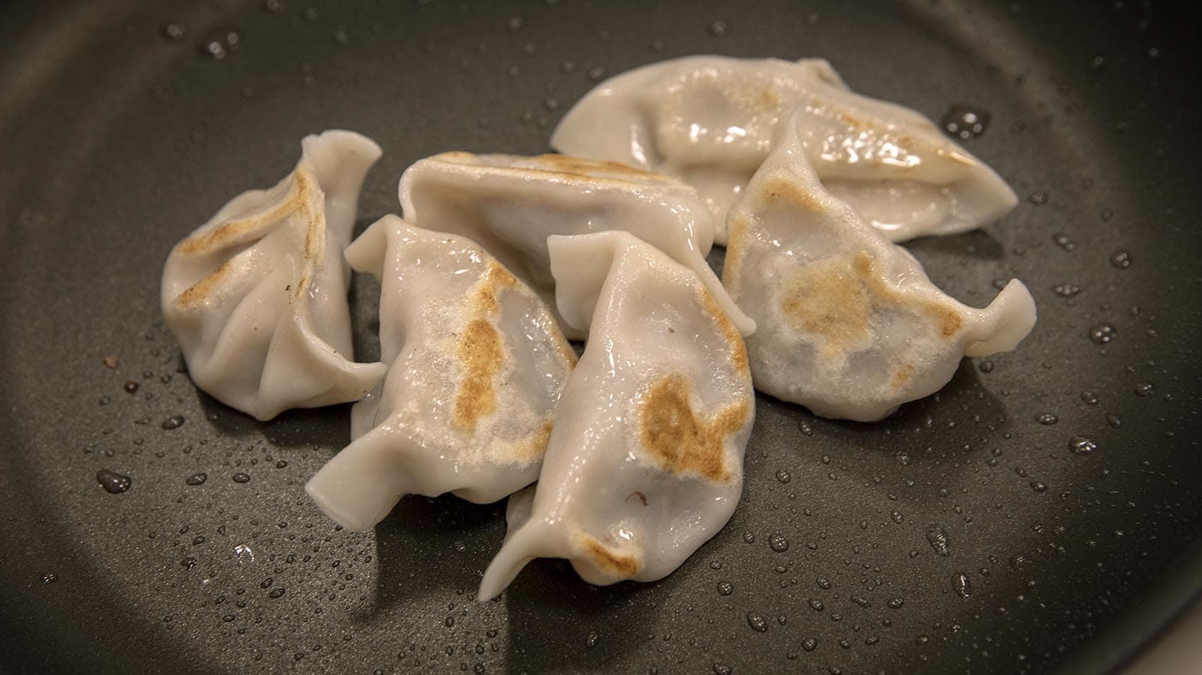 Billions of people around the world are celebrating the Lunar New Year. In China, one dish in particular is a staple of the celebration: pork dumplings. (Robin Lubbock/WBUR)