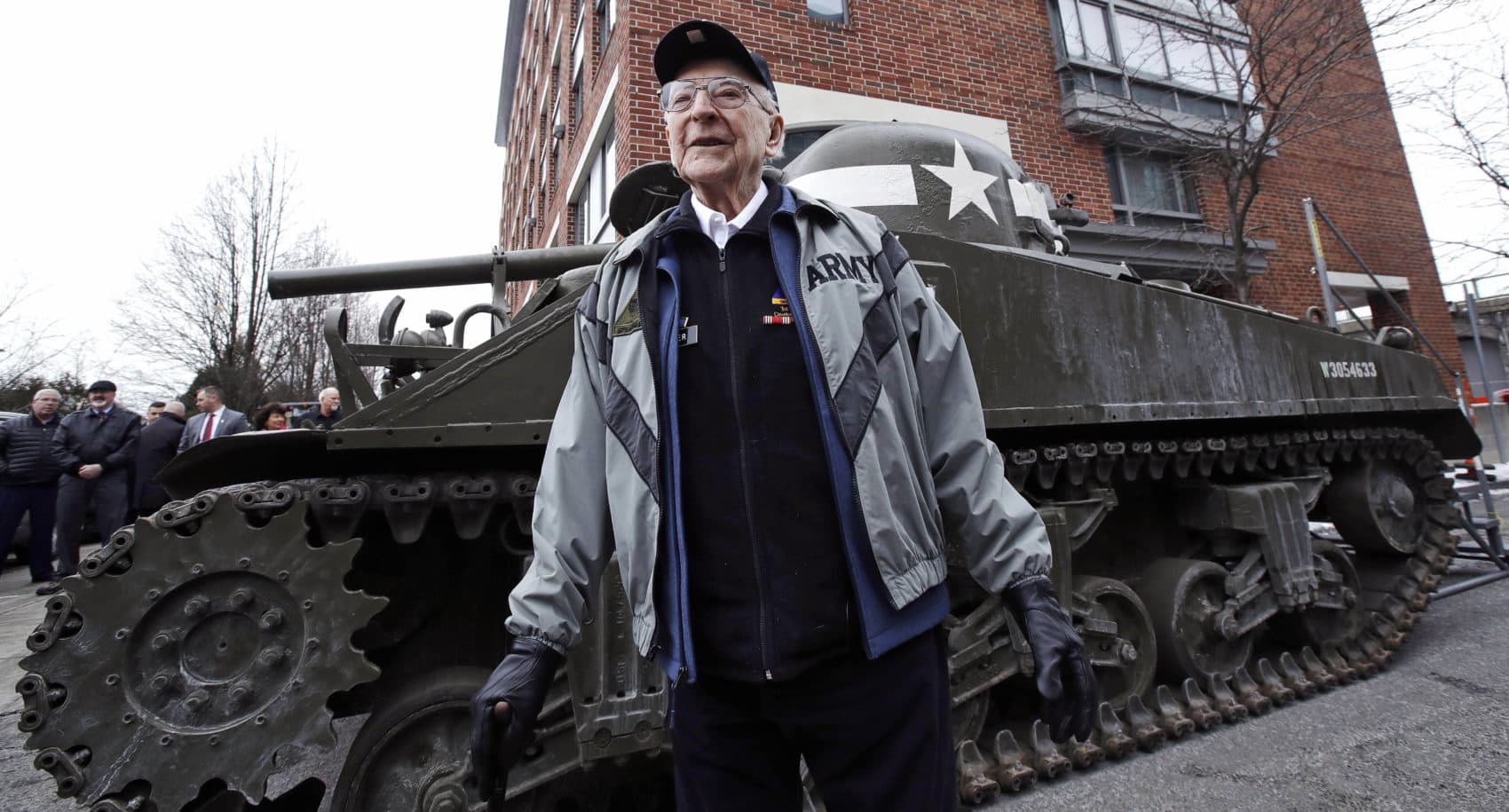 World War II tank gunner Clarence Smoyer poses for a portrait near the Charlestown Naval Shipyard in Boston, Feb. 20, 2019. The 95-year-old veteran was surprised with a ride through the streets of Boston in a Sherman tank, one of the tanks most widely used by the U.S. during the war. (Charles Krupa/AP)
