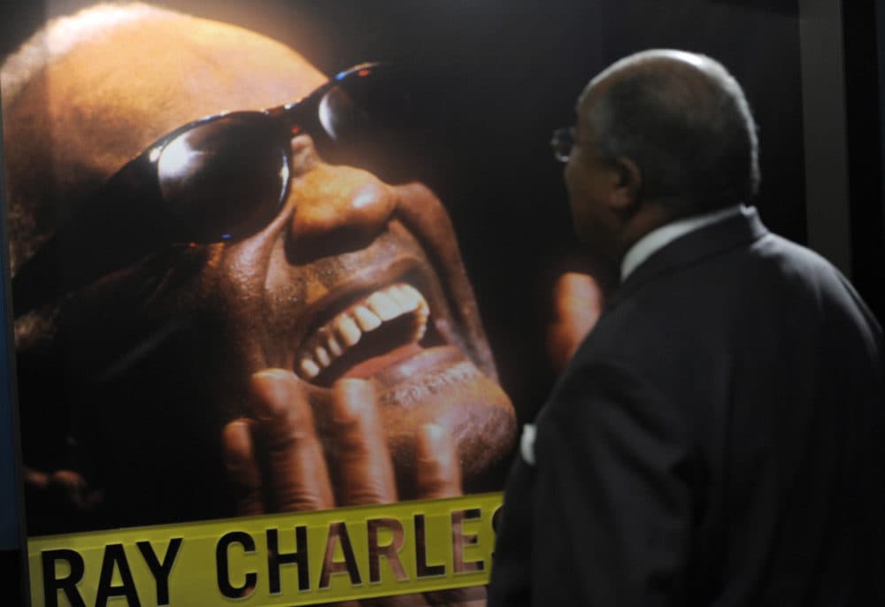 In this Sept. 23, 2010 photo, a visitor to The Ray Charles Memorial Library looks at a display during the library's official opening in Los Angeles. The library is located on the ground floor of the Los Angeles building Charles designed for his offices and recording studio. (AP Photo/Chris Pizzello)
