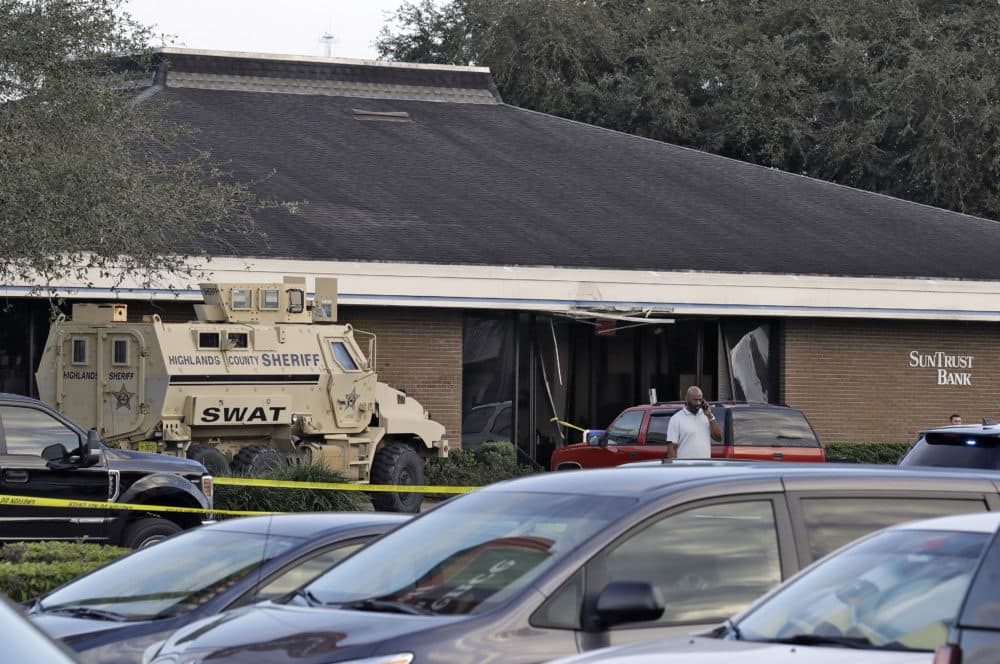 A Highlands County Sheriff's SWAT vehicle is stationed out in front of a SunTrust Bank branch, Wednesday, Jan. 23, 2019, in Sebring, Fla., where five people were shot and killed. (Chris O'Meara/AP)