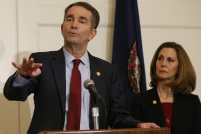 Virginia Gov. Ralph Northam, left, gestures as his wife, Pam, listens during a press conference in the Governors Mansion at the Capitol in Richmond, Va., Saturday, Feb. 2, 2019. Northam is under fire for a racist photo that appeared on his page in his college yearbook. (Steve Helber/AP)
