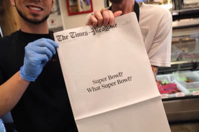 Brothers Damien Hanford, right, and Matthew Hanford, hold their copy of the mostly blank front page of the New Orleans Times-Picayune newspaper, at Bergeron Boudin and Cajun Meats, in Harahan, La., Monday, Feb. 4, 2019. The newspaper's nearly blank front page summarized what those in the Big Easy think of the New England Patriots' win over the Rams on Sunday: &quot;Super Bowl? What Super Bowl?&quot; (Gerald Herbert/AP)