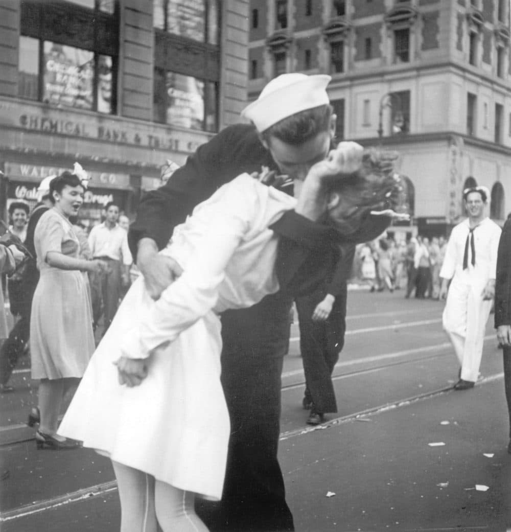 In this Aug. 14, 1945 file photo provided by the U.S. Navy, a sailor and a woman kiss in New York's Times Square, as people celebrate the end of World War II. (Victor Jorgensen/U.S. Navy, File)