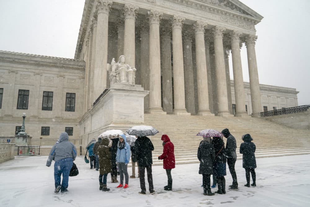 Visitors wait to enter the Supreme Court on Capitol Hill in Washington, Wednesday, Feb. 20, 2019. The Supreme Court is ruling unanimously that the Constitution's ban on excessive fines applies to the states. (J. Scott Applewhite/AP)