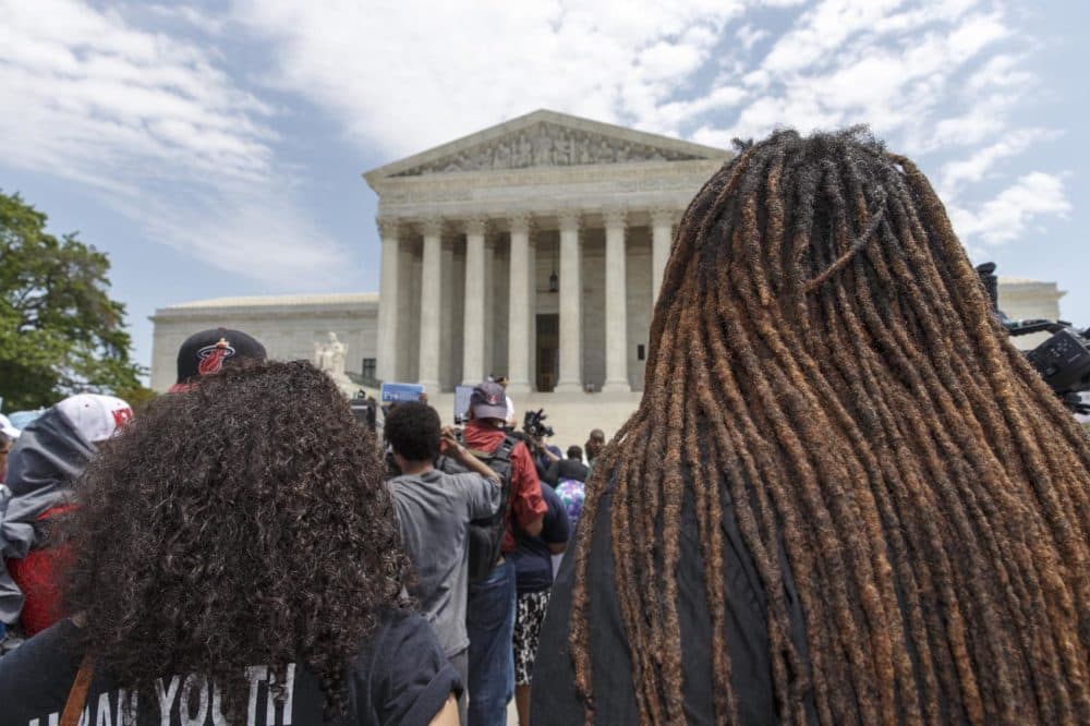 Students, parents and educators rally at the Supreme Court in Washington, Tuesday, May 13, 2014, on the 60th anniversary Brown v. Board of Education decision that struck down the separate but equal concept established under Plessy v. Ferguson that kept schools segregated. (AP Photo)