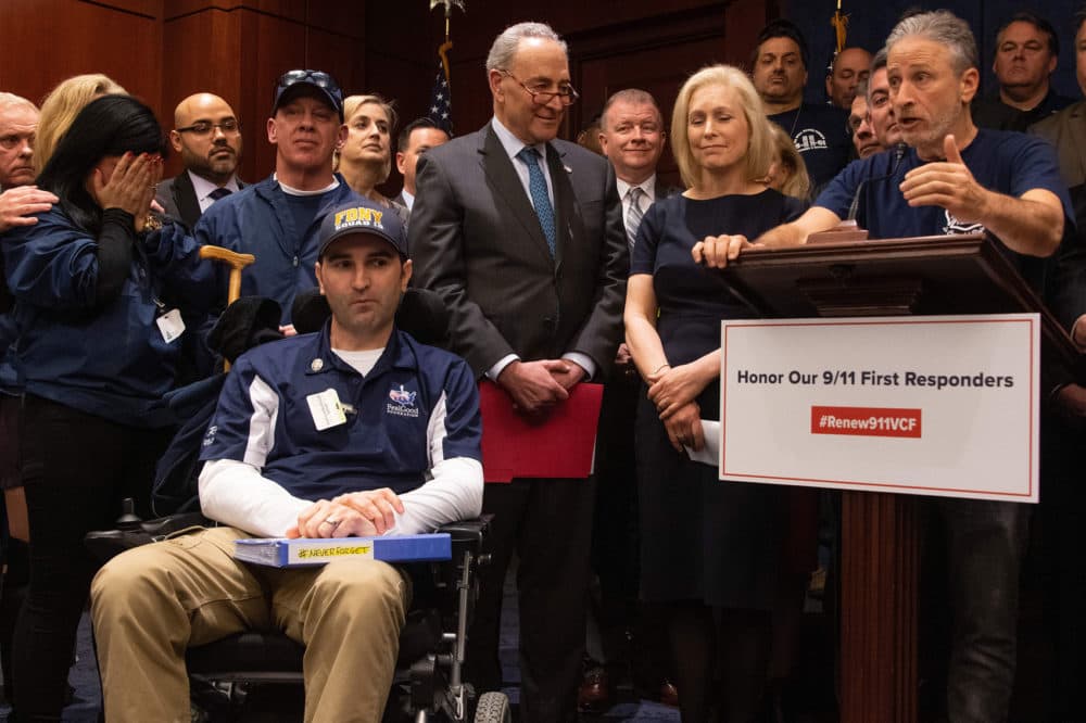 Former &quot;Daily Show&quot; host Jon Stewart (right) with Senate Minority Leader Chuck Schumer (center), D-N.Y., Sen. Kirsten Gillibrand (second right), D-N.Y., and 9/11 first responders, survivors and their families to discuss the introduction of the bipartisan &quot;Never Forget the Heroes: Permanent Authorization of the September 11th Victim Compensation Fund Act.&quot; (Jim Watson/AFP/Getty Images)