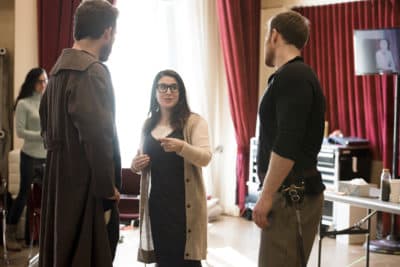 Director Sarna Lapine discusses a scene with Brandon Cedel and Duncan Rock. (Courtesy Liza Voll)
