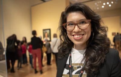 Layla Bermeo, assistant curator of American paintings, at the &quot;Frida Kahlo and Arte Popular&quot; exhibition at the MFA. (Robin Lubbock/WBUR)