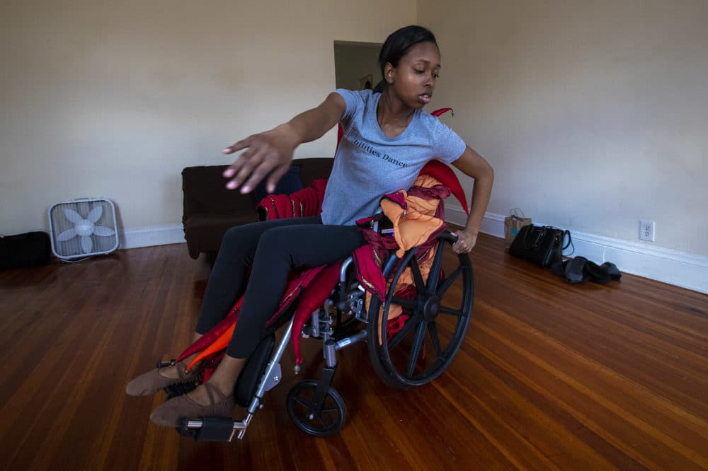 Ellice Patterson dances in her wheelchair at her home in Brookline. (Jesse Costa/WBUR)