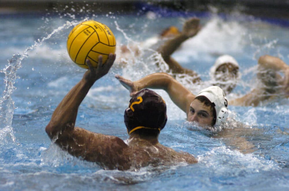 A USC water polo player prepares to pass in a 2005 game. (Ralph Wilson/AP)