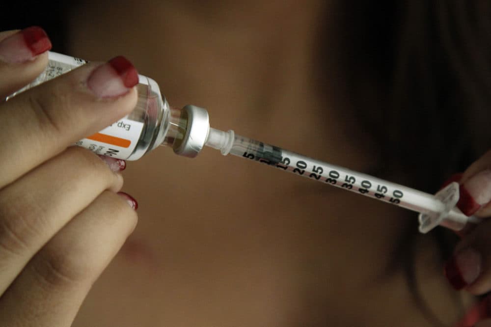 Judith Garcia, 19, fills a syringe as she prepares to give herself an injection of insulin at her home in the Los Angeles suburb of Commerce, Calif. (Reed Saxon/AP)