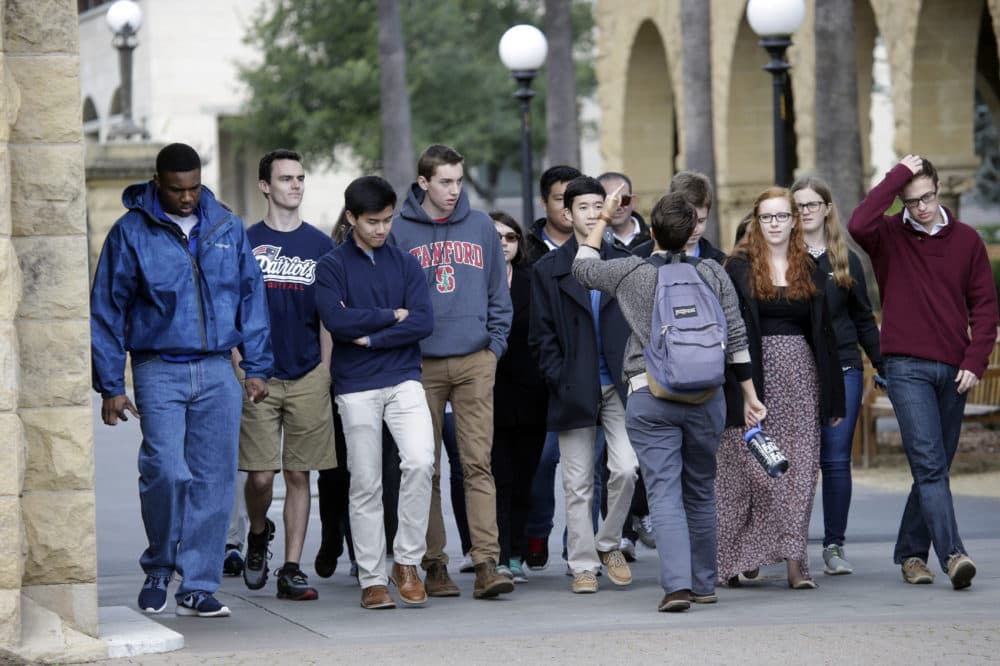A group tours the campus at Stanford University Wednesday, Jan. 13, 2016, in Stanford, Calif. (Marcio Jose Sanchez/AP)