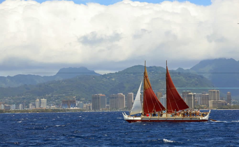 In this April 29, 2014 file photo, the Hokulea sailing canoe is seen off Honolulu. The Polynesian voyaging canoe is returning to Hawaii after a three-year journey around the world guided only by nature with navigators using no modern navigation to guide Hokulea across 40,000 nautical miles to 19 countries. Thousands are expected to welcome the double-hulled canoe to Oahu, Hawaii, on Saturday, June 17, 2017. (AP Photo/Sam Eifling, File)