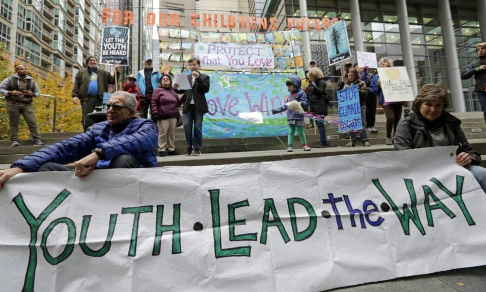 Alex Sayres, 12, speaks during a rally by youth activists and others in support of a climate change lawsuit, Monday, Oct. 29, 2018, in Seattle. (Elaine Thompson/AP)