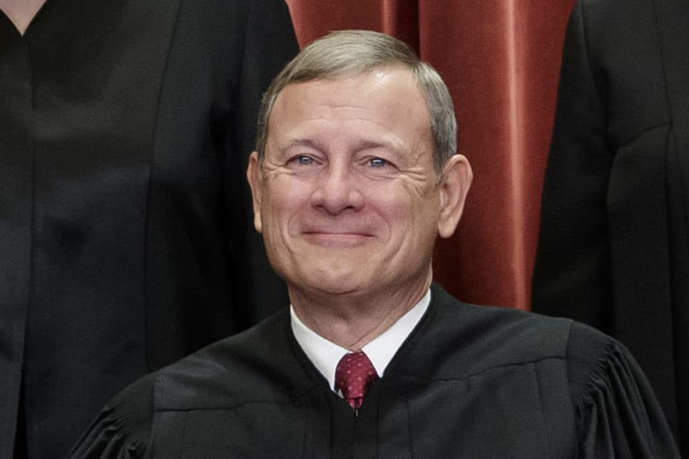 Chief Justice of the United States, John G. Roberts, nominated by President George W. Bush, sits with fellow Supreme Court justices for a group portrait at the Supreme Court Building in Washington, Friday, Nov. 30, 2018. (J. Scott Applewhite/AP)