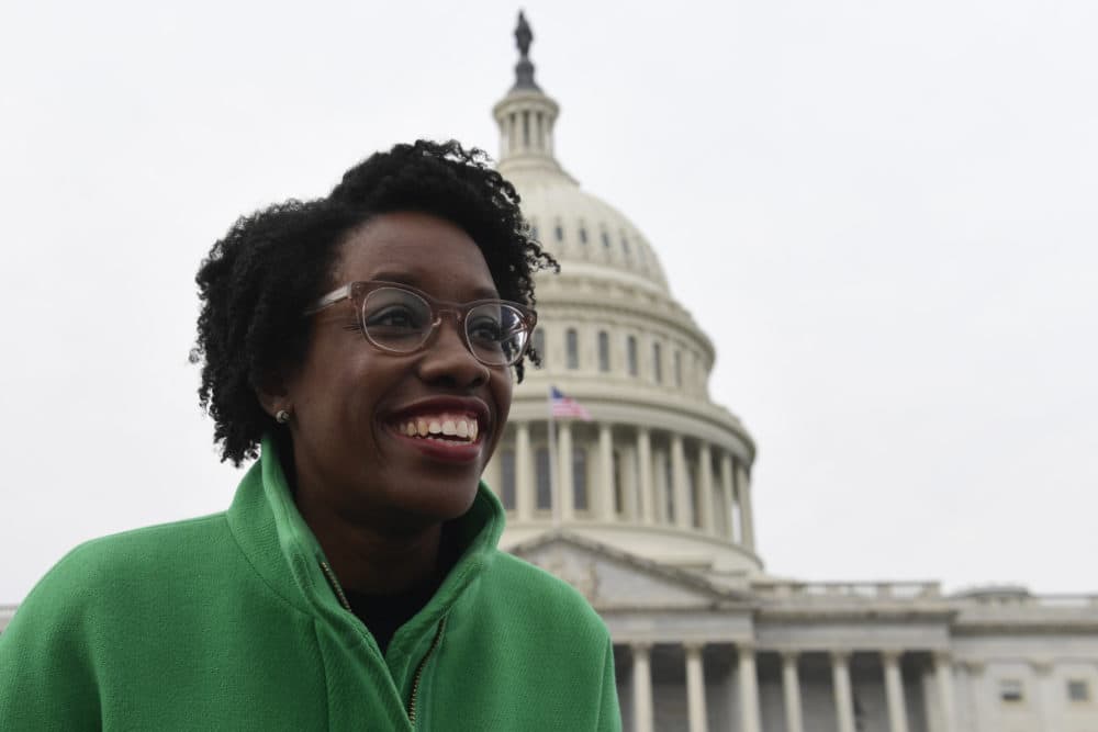 Rep. Lauren Underwood, D-Ill., left, reacts as she talks with people following a group photo with the women of the 116th Congress on Capitol Hill in Washington, Friday, Jan. 4, 2019. (Susan Walsh/AP)