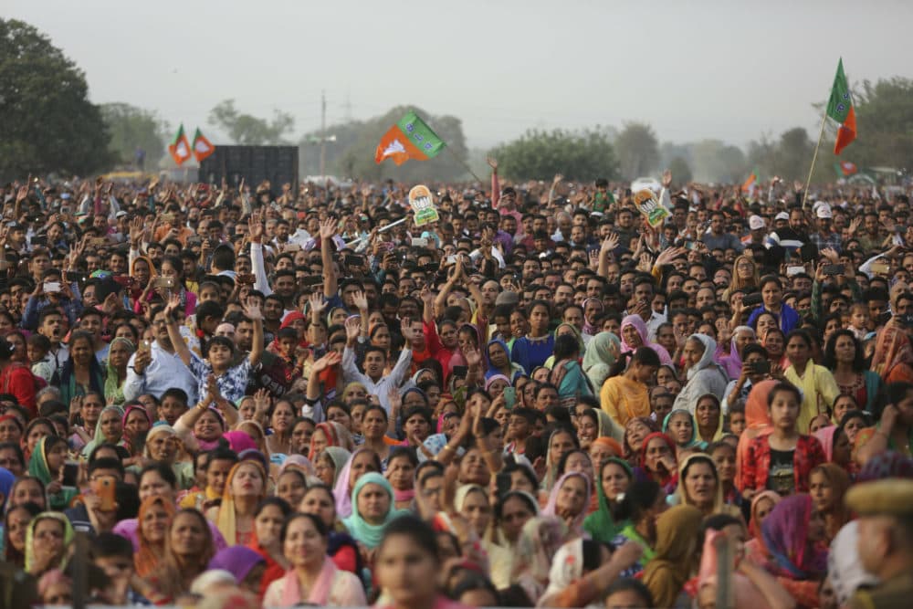 Bharatiya Janata Party (BJP) supporters attend an election rally addressed by Indian Prime Minister Narendra Modi at Dumi village in Akhnoor, about 20 kilometers from Jammu, India, Thursday, March 28, 2019. India's general elections will be held in seven phases starting April 11. (Channi Anand/AP)