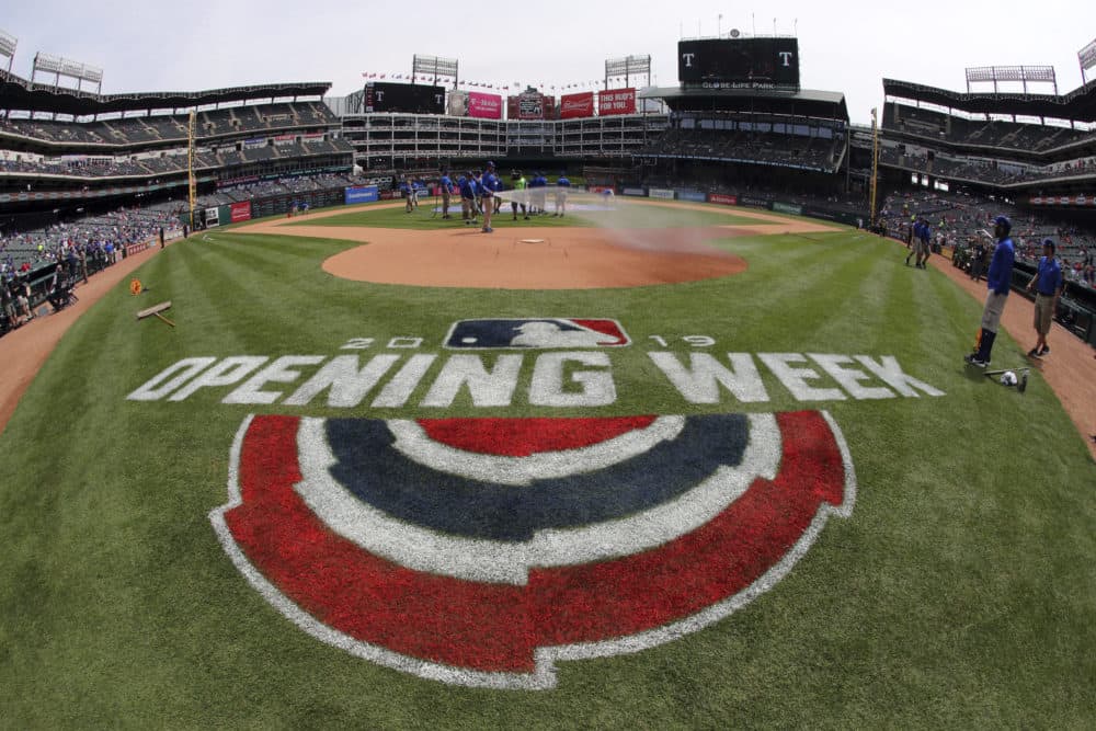 The grounds crew prepares the field for the opening day baseball game between the Chicago Cubs and the Texas Rangers Thursday, March 28, 2019 in Arlington, Texas. (Richard W. Rodriguez/AP)