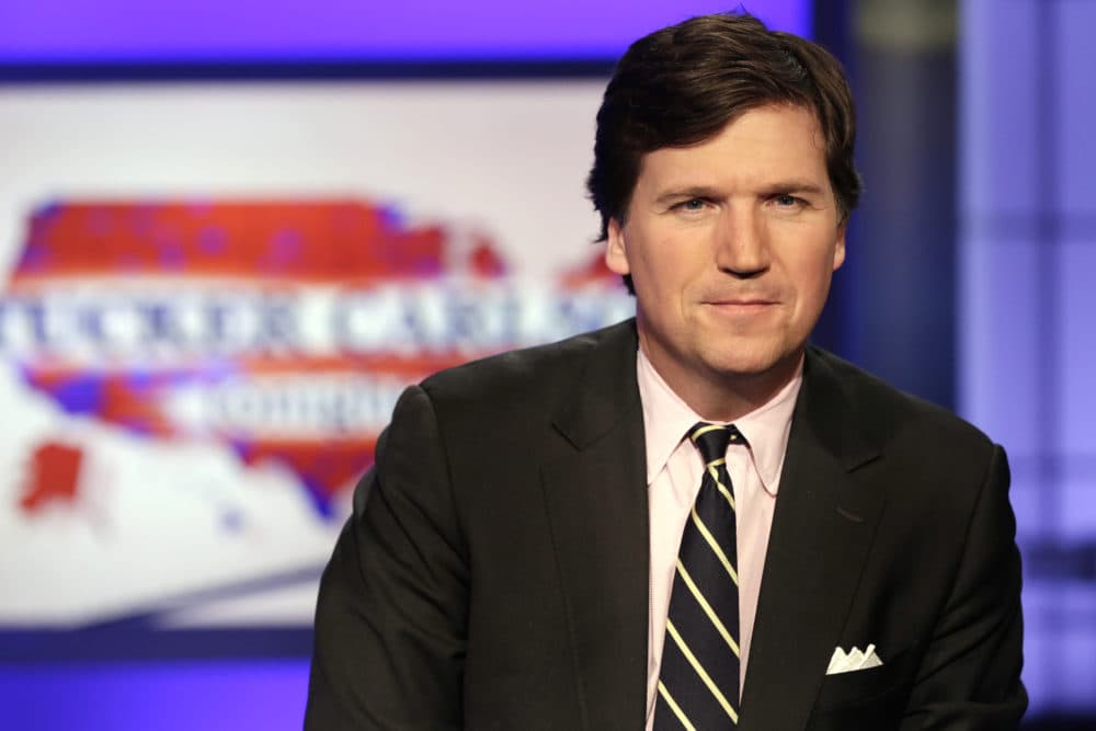 Tucker Carlson poses for photos in a Fox News Channel studio, in New York, Thursday, March 2, 2107. (Richard Drew/AP)