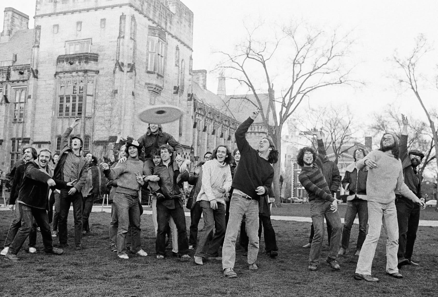 Yale University students join in a Frisbee game Wednesday, April 10, 1974. (Bob Child/AP)