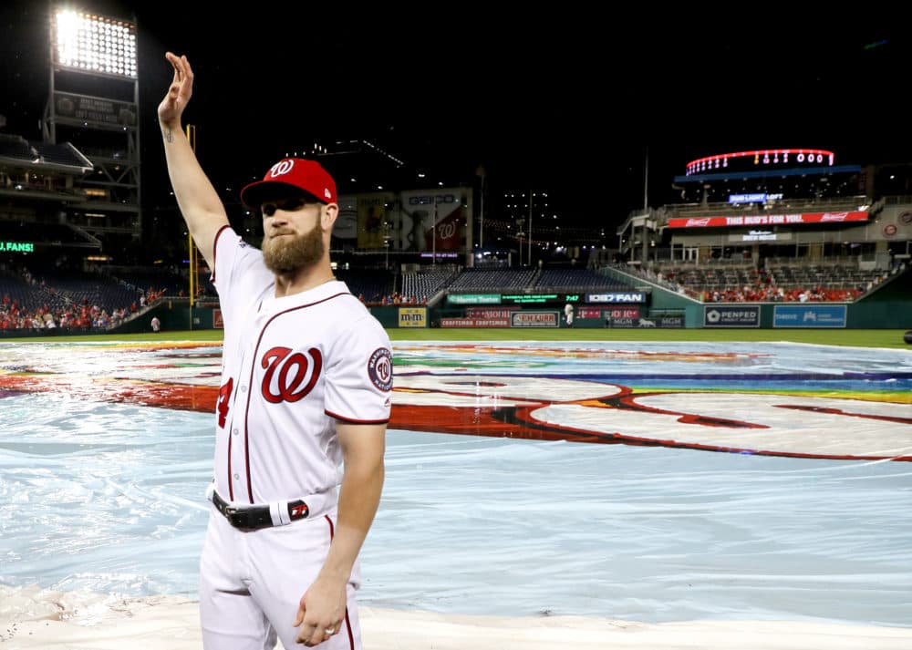 Bryce Harper waves to the crowd following the last home Nationals home of the 2018 season. Harper signed with the Philadelphia Phillies this week. (Rob Carr/Getty Images)