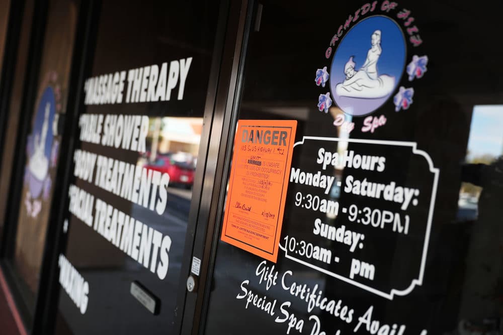 A danger sign is seen on the front door of the Orchids of Asia Day Spa in connection to New England Patriots owner Robert Kraft being charged with allegedly soliciting for sex on February 22, 2019 in Jupiter, Florida. (Joe Raedle/Getty Images)