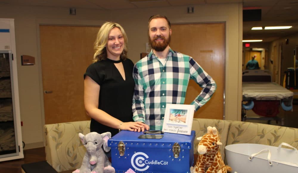 Chris and Emily Fricker with their CuddleCot. (Courtesy of Emily Fricker)