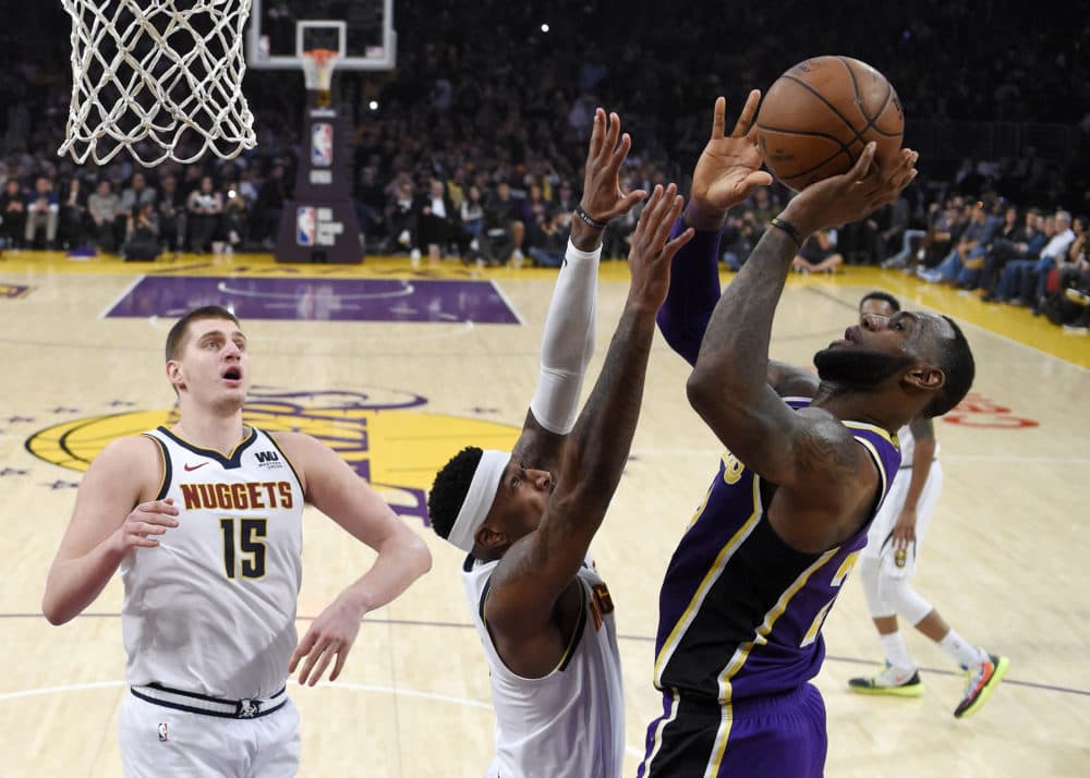 Los Angeles Lakers forward LeBron James scores during Wednesday's game in Los Angeles. With that basket, James moved past Michael Jordan for fourth place on the NBA career scoring list. (Mark J. Terrill/AP)