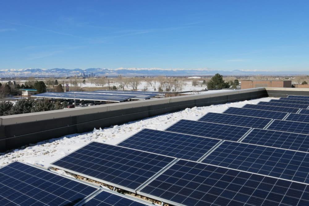 Kaiser Permanente’s regional Denver office hosts solar panels on its roof and carports. (Grace Hood/Colorado Public Radio)