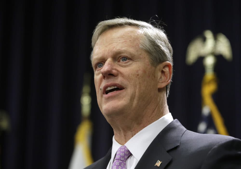 Massachusetts Gov. Charlie Baker faces reporters as he unveils his state budget proposal during a news conference on Jan. 23 at the State House in Boston. (Steven Senne/AP)
