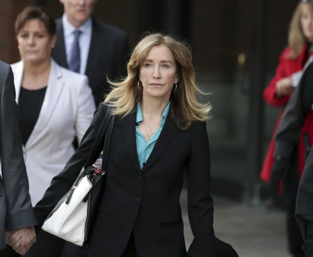 Actress Felicity Huffman departs federal court in Boston on April 3. (Charles Krupa/AP)
