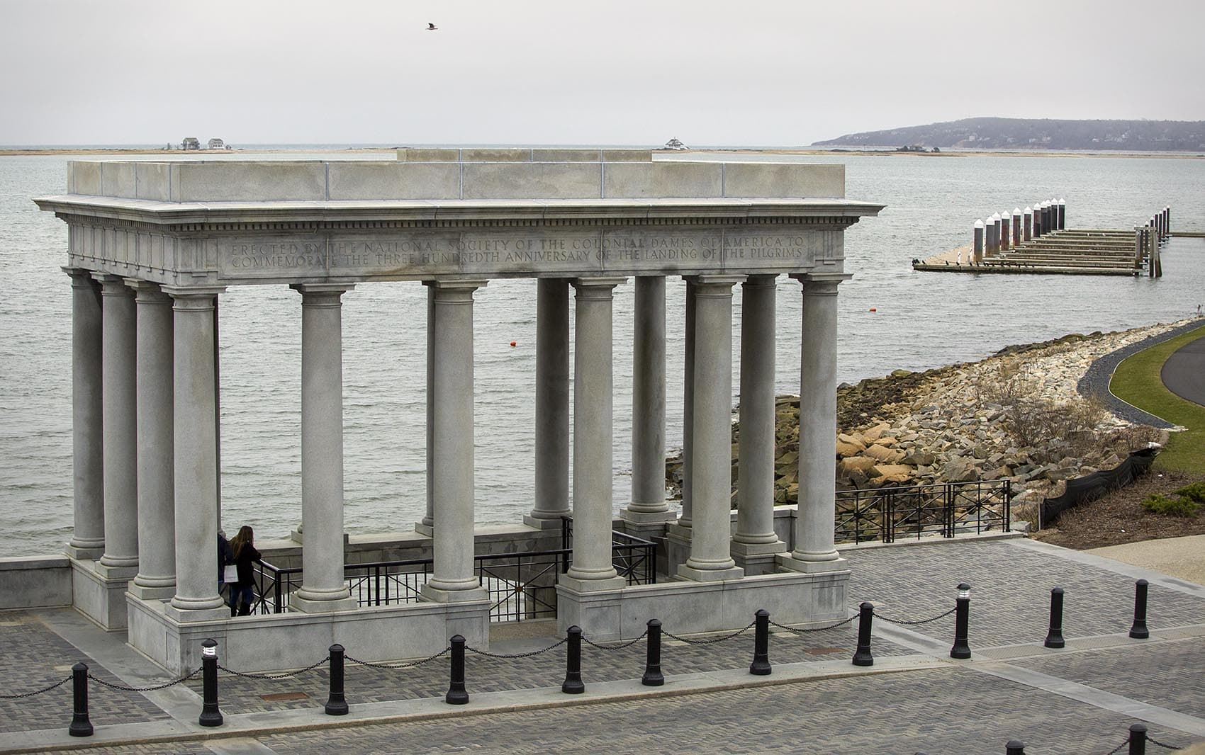 The Plymouth Rock portico looks out across the Plymouth Bay to Rocky Point, the location of Pilgrim Nuclear Power Station. (Robin Lubbock/WBUR)